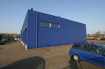 Nieuwe gevelcoating voor bedrijfspand met behulp van airless coating