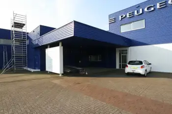 Nieuwe gevelcoating voor bedrijfspand met behulp van airless coating